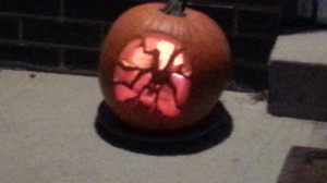 This was the pumpkin I carved this year. Fuzzy photo, and the pumpkin was a little rotted on the inside on the bottom, but all things considered, I think it came out pretty well!